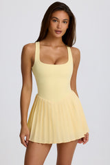 Soft Active Open-Back Pleated Tennis Dress in Lemon